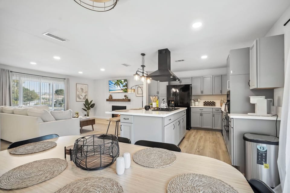 Dining Area overlooking Living Room Area and Kitchen Island