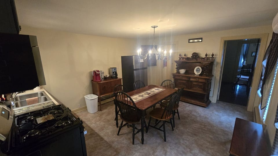 Antique carved wooden hutch stores the pots and pans