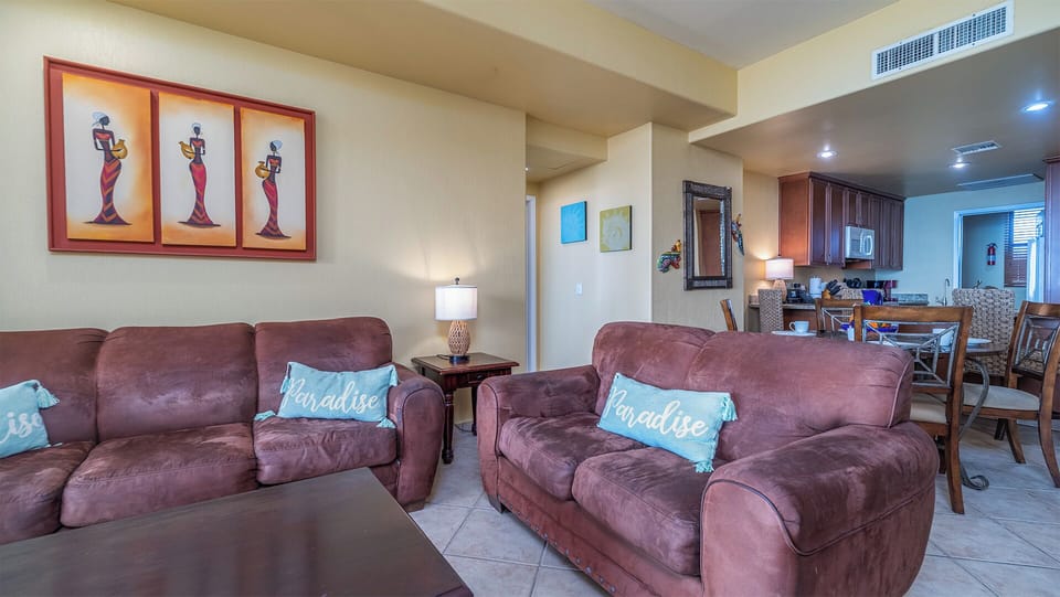 The living groom flows into the kitchen, and dining area.