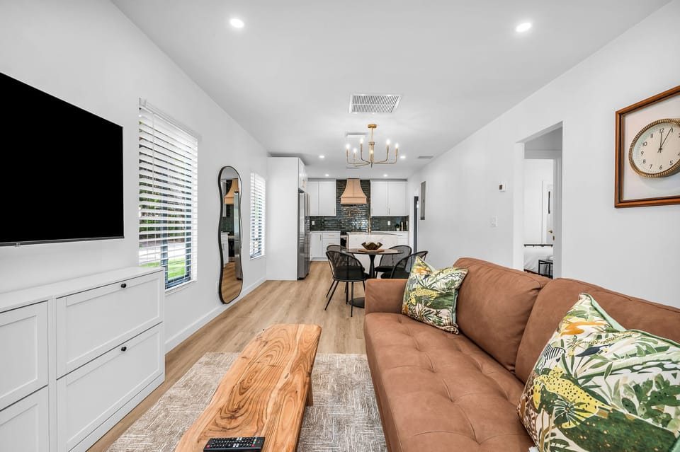 Beautifully decorated living and dining area including a 55" Smart TV.