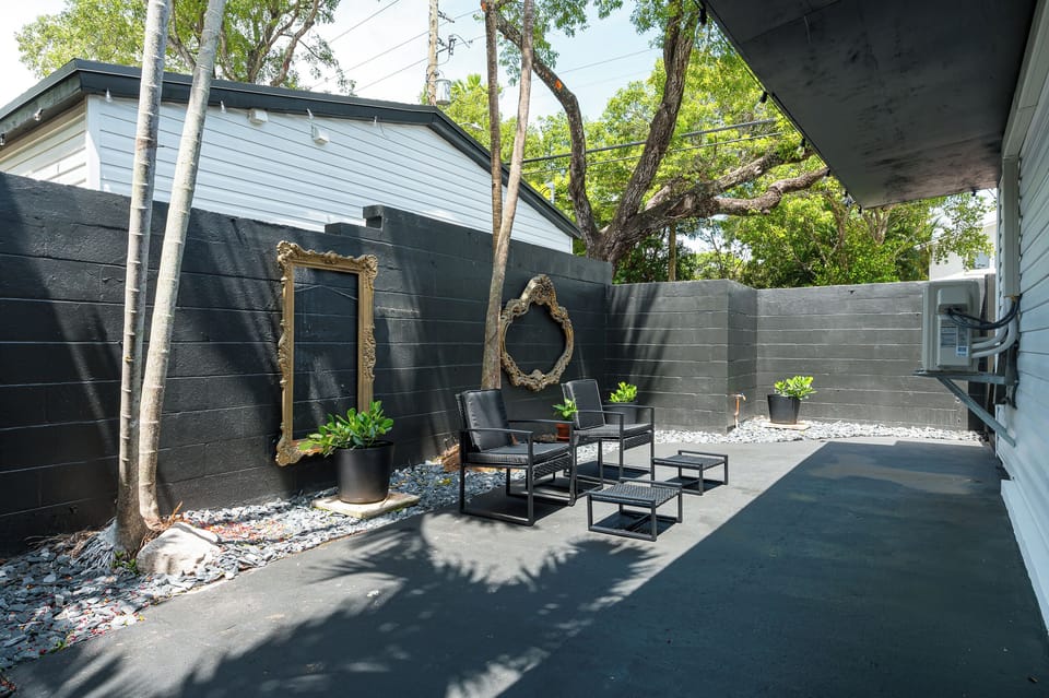 Quiet and private outdoor patio space with seating, grill, and cafe lights!