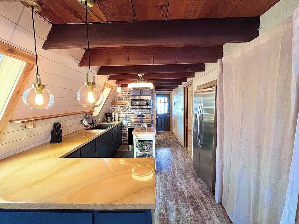 updated kitchen with new, stackable washer/dryer behind the curtain (1)