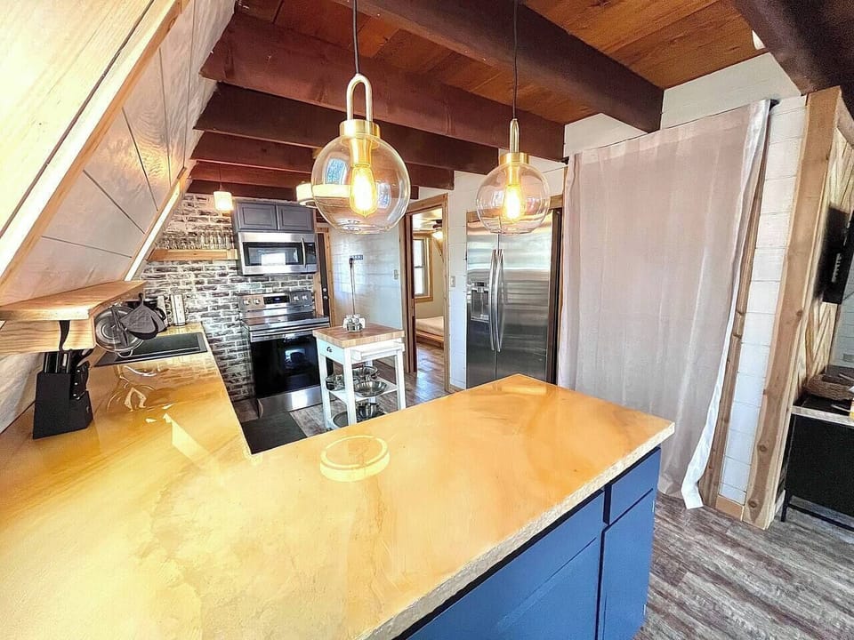 updated kitchen with new, stackable washer/dryer behind the curtain (2)