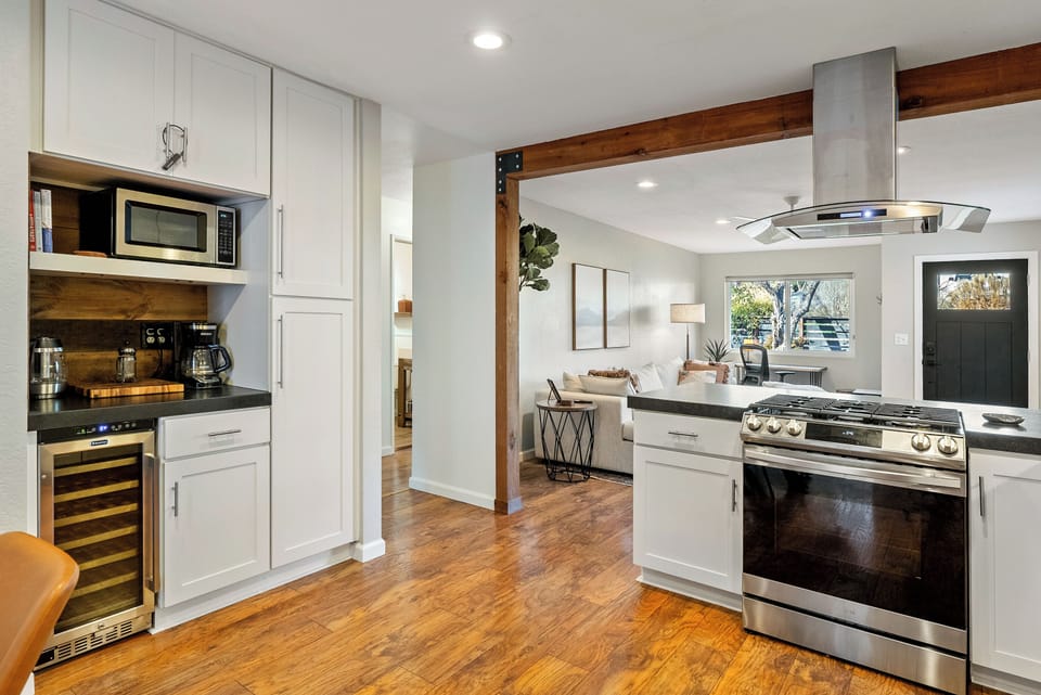 Enjoy the convenience of this thoughtfully designed kitchen, featuring a built-in wine fridge and a dedicated coffee station.