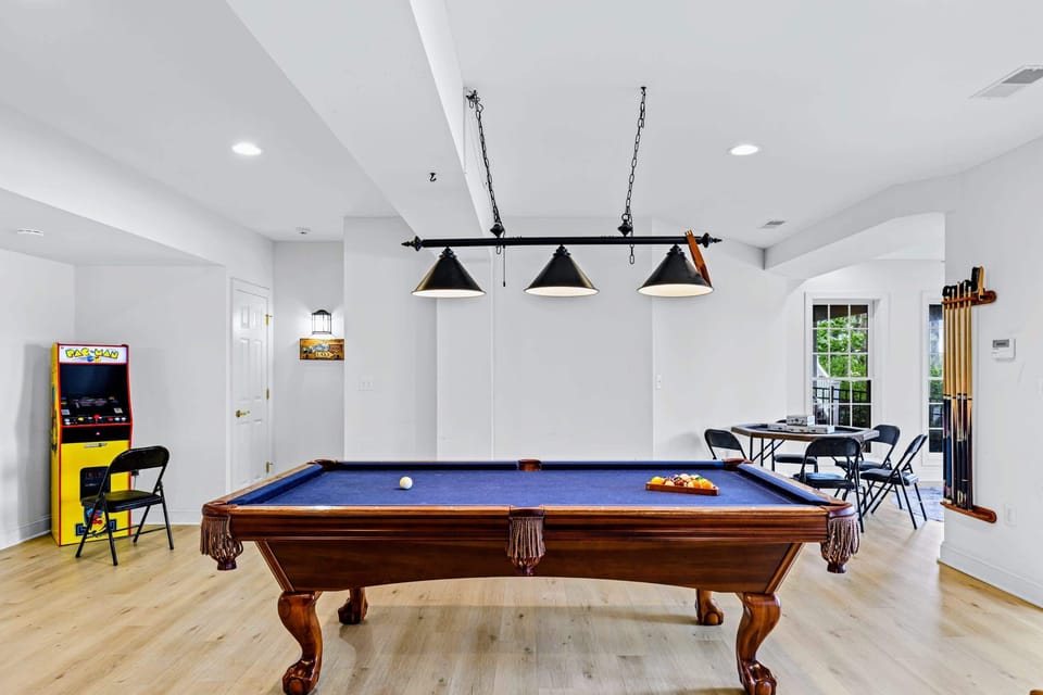 Rack 'em up: the pool table is the centerpiece of the downstairs game room.