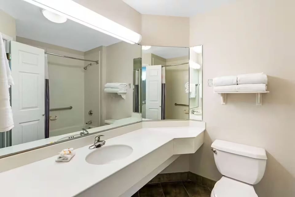 Focus in comfort with a dedicated desk and convenient in-room TV.