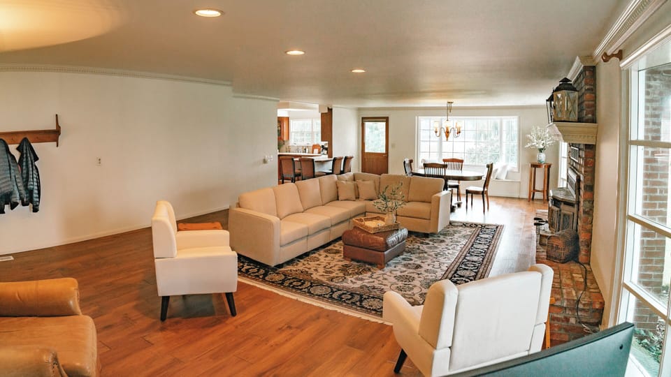 Living room has a queen sofa bed (sleeps 2) and a sectional (sleeps 1) with TV