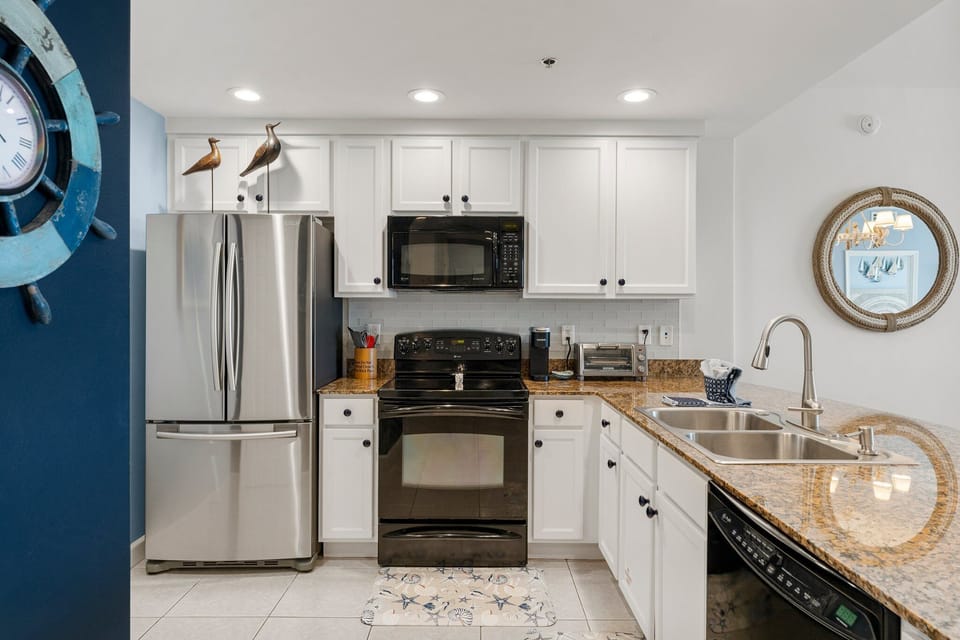 Dishwasher, oven, microwave and refrigerator.