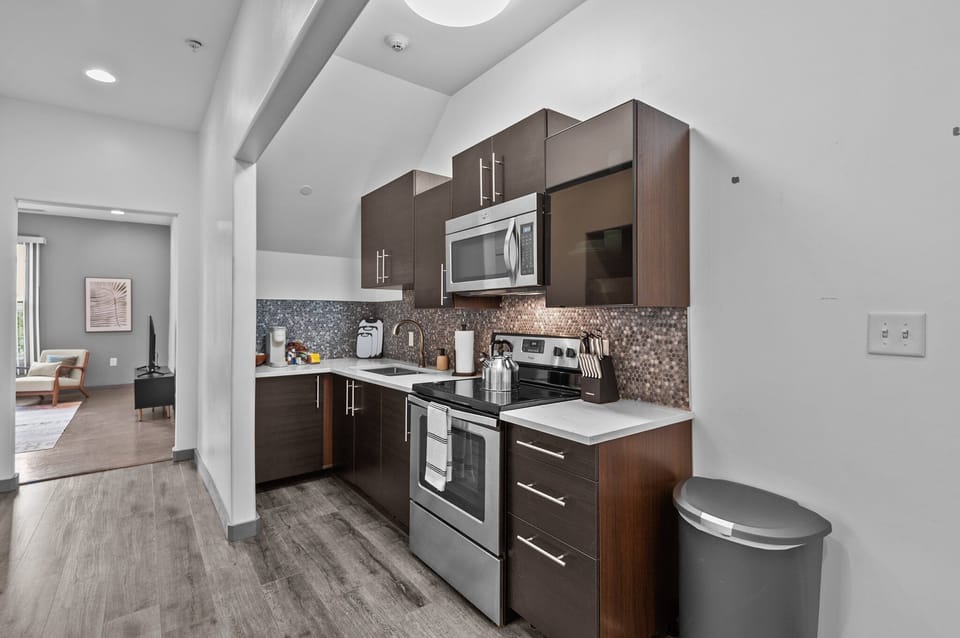 Prepare meals with ease in our sleek and functional kitchen
