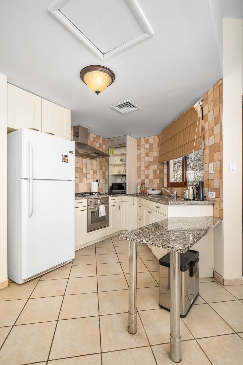 This kitchen strikes the perfect balance between functionality and charm, ready for all your culinary adventures.