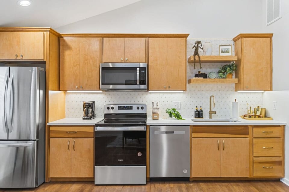 Fully equipped kitchen with all your cooking essentials, drip coffee maker + coffee. Dining table with seating for 2. This room opens up into the living room. Gorgeous mid century modern decor all throughout the condo.