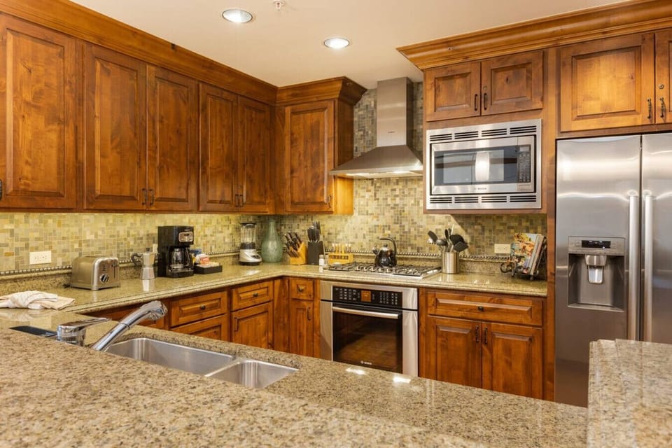 Fully Stocked Kitchen with Bar Seating