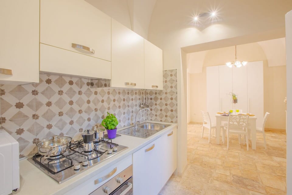 Interior Design, Flooring, Floor, Ceiling, Countertop, Kitchen, Room, Major Appliance, Lighting, Kitchen Appliance