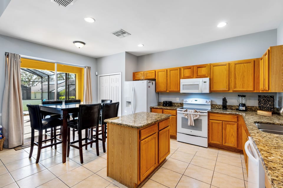 Spacious open-concept kitchen with a large island—perfect for entertaining and gathering with family and friends