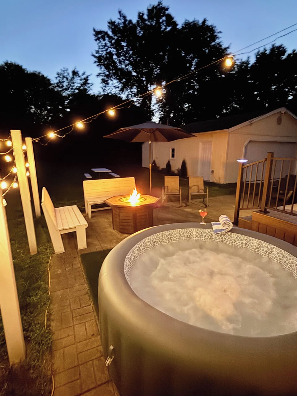 PATIO with Night Lighting, HOT TUB, Gas FIRE TABLE,  Bench Seating, & Chairs
