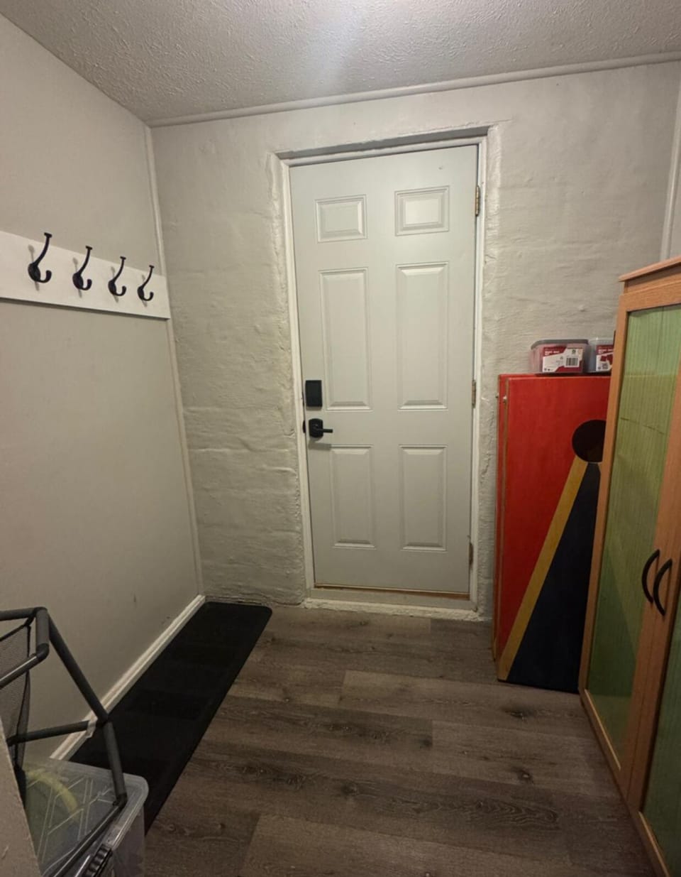 MAIIN LEVEL, MUDROOM;  Bean Bag toss with boards, Cabinet with grilling tools, Hot Tub Towels, Instruction and safety regulations for Hot Tub, Gas Fire Table, and Gas Grill... Ball Bin with various balls for backyard play