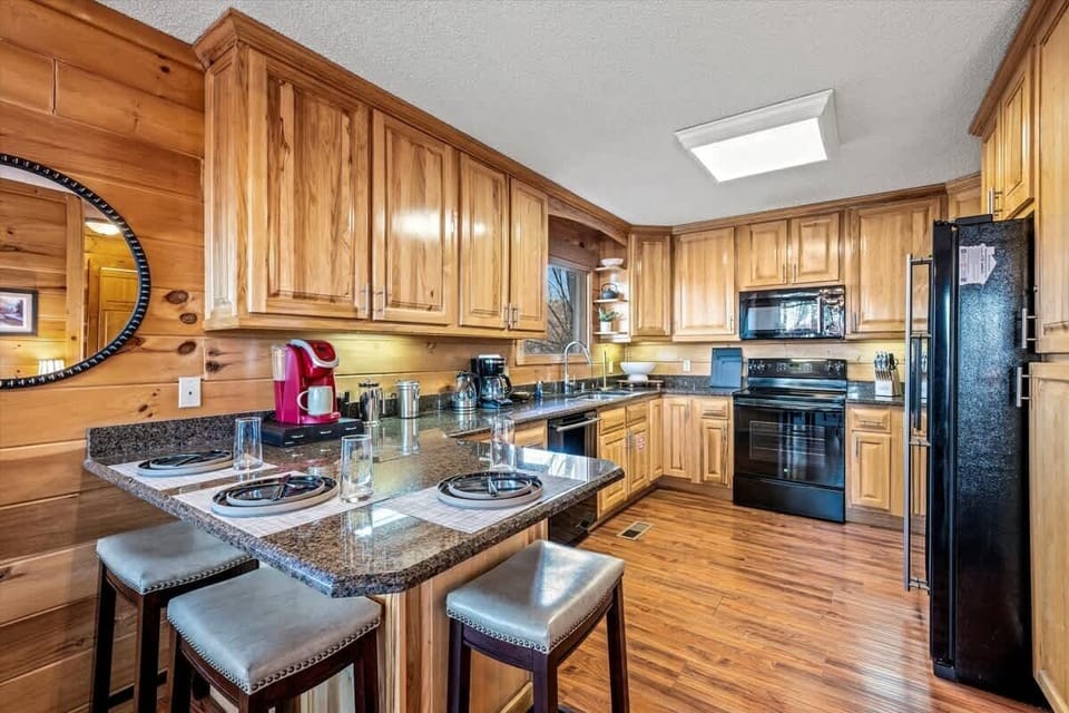 Fully stocked kitchen with modern appliances and rustic charm—perfect for home-cooked meals.
