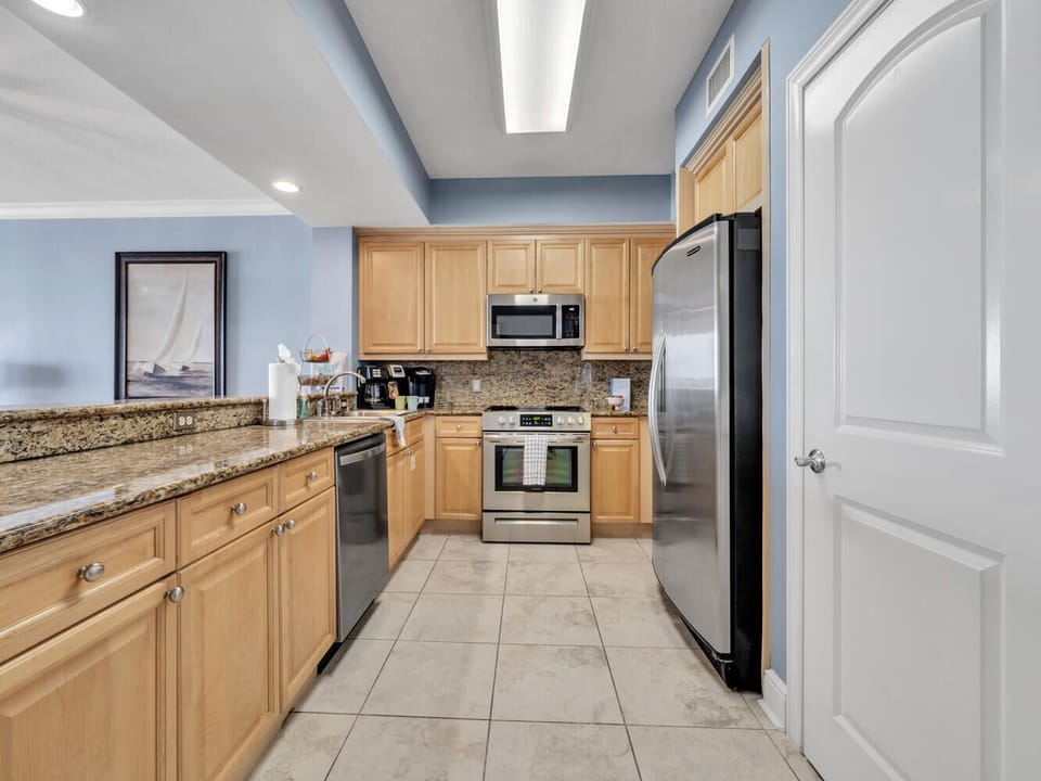Your fully equipped kitchen awaits with granite countertops, modern appliances, and everything you need to create memorable meals.