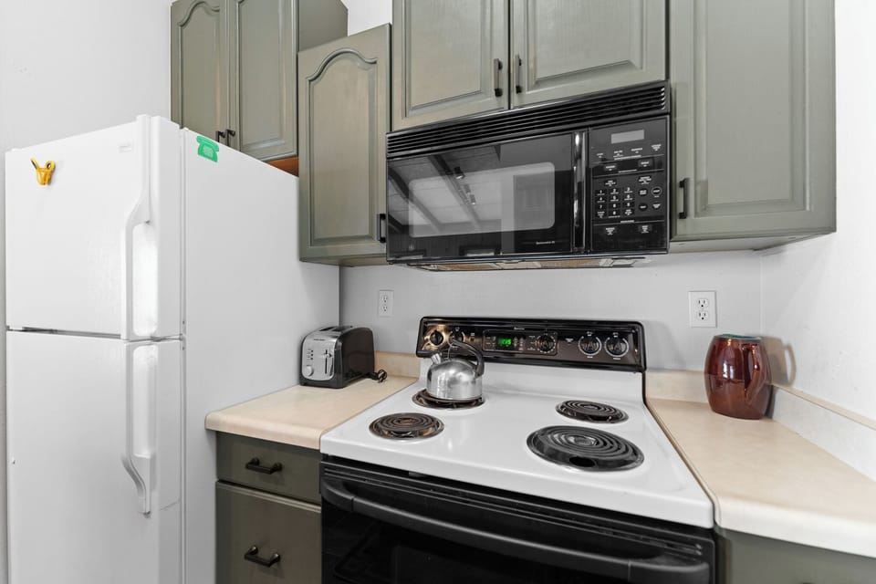 Your fully equipped kitchen features everything you need for home cooking, from the microwave and stove to ample storage space.