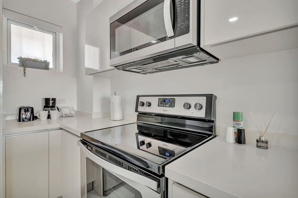 Get ready to cook, create, and indulge in this sleek, fully stocked kitchen - Stainless steel appliances, spacious counters, and everything you need to dine in style - Whether it's homemade brunch or late night snacks, this kitchen is ready for you