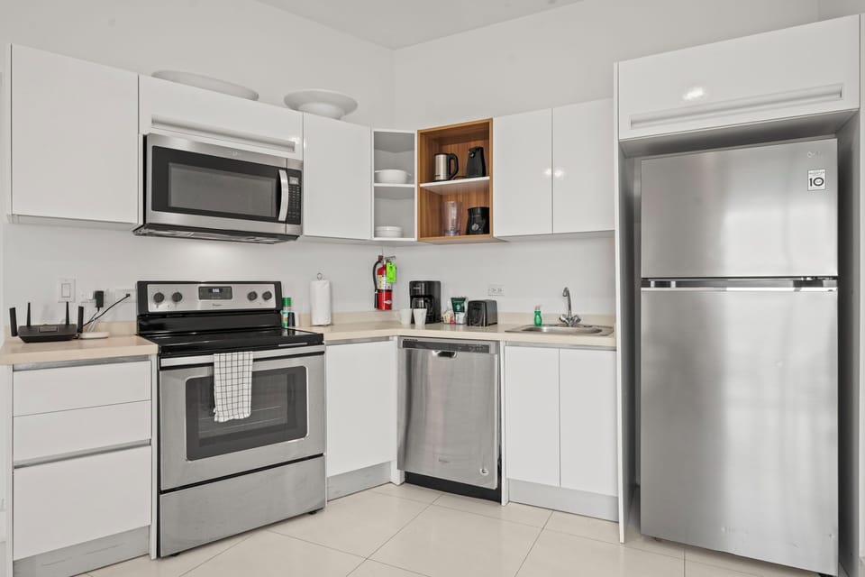 Cook, dine & unwind in this stylish, fully equipped kitchen & dining space - Whether you're whipping up a meal or enjoying takeout, this cozy setup has you covered - Bright, open & inviting, perfect for morning coffee or an evening glass of wine
