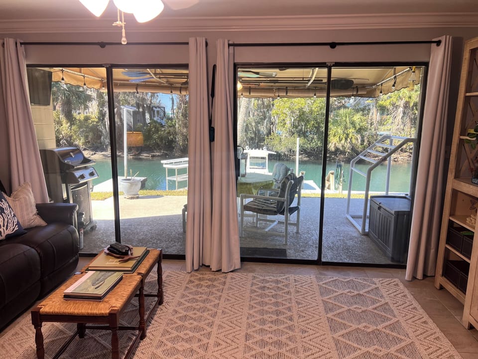 Main living area looking towards the back porch and water