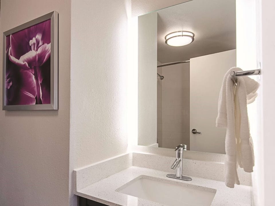 Refresh at a spotless vanity with bright, flattering lighting.