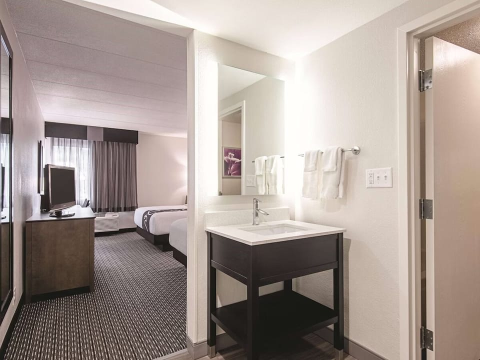 Refresh at a bright vanity with clean towels within reach.