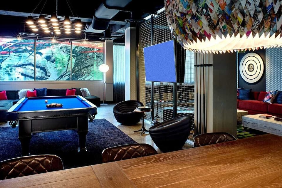 Sip wine and play chess in a cozy game alcove.