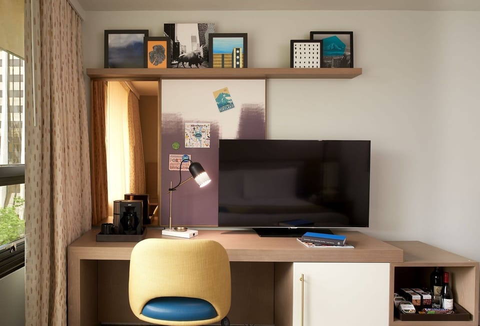 Work comfortably at the desk with entertainment within reach.