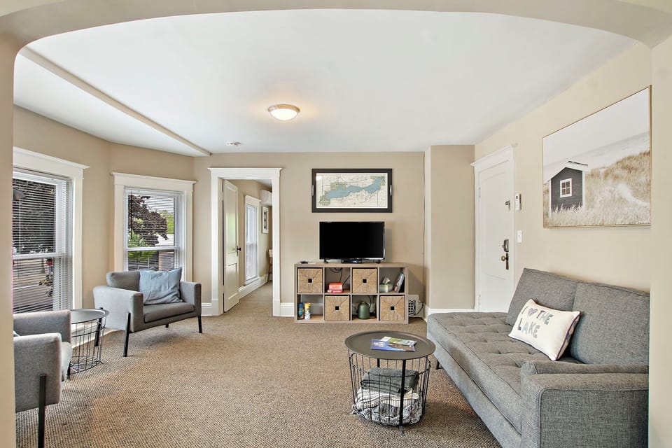 Main living area with seating, couch, and smart TV