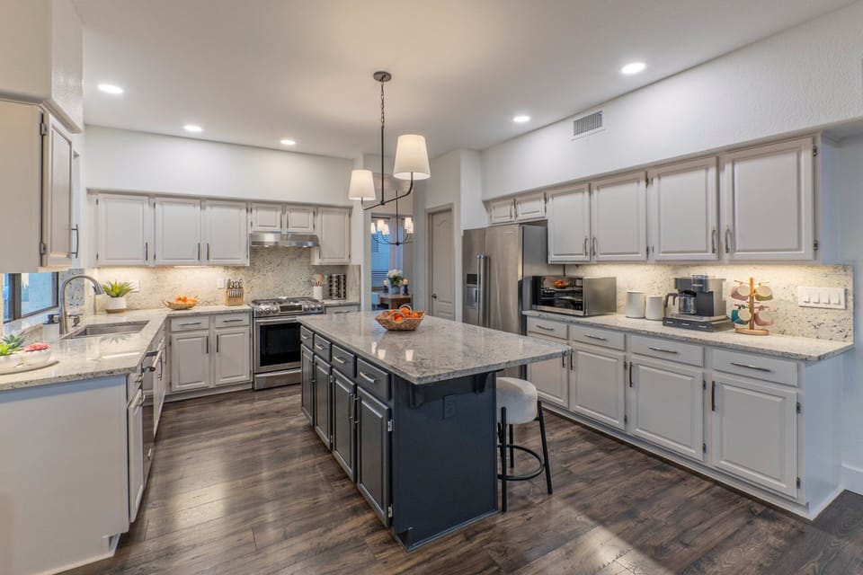 Modern and well equipped kitchen has both Keurig and drip coffee makers.