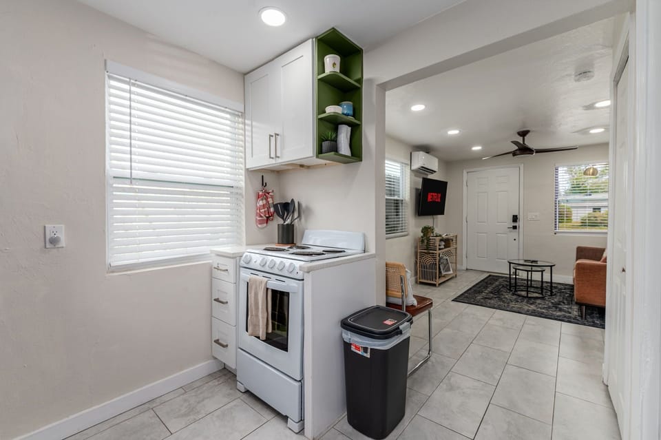 An open flow from the kitchen into the living room and other spaces, creating a bright and inviting atmosphere.