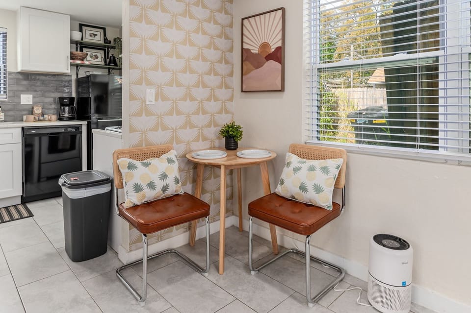 A cozy dining area perfect for two, ideal for enjoying meals or a morning coffee.