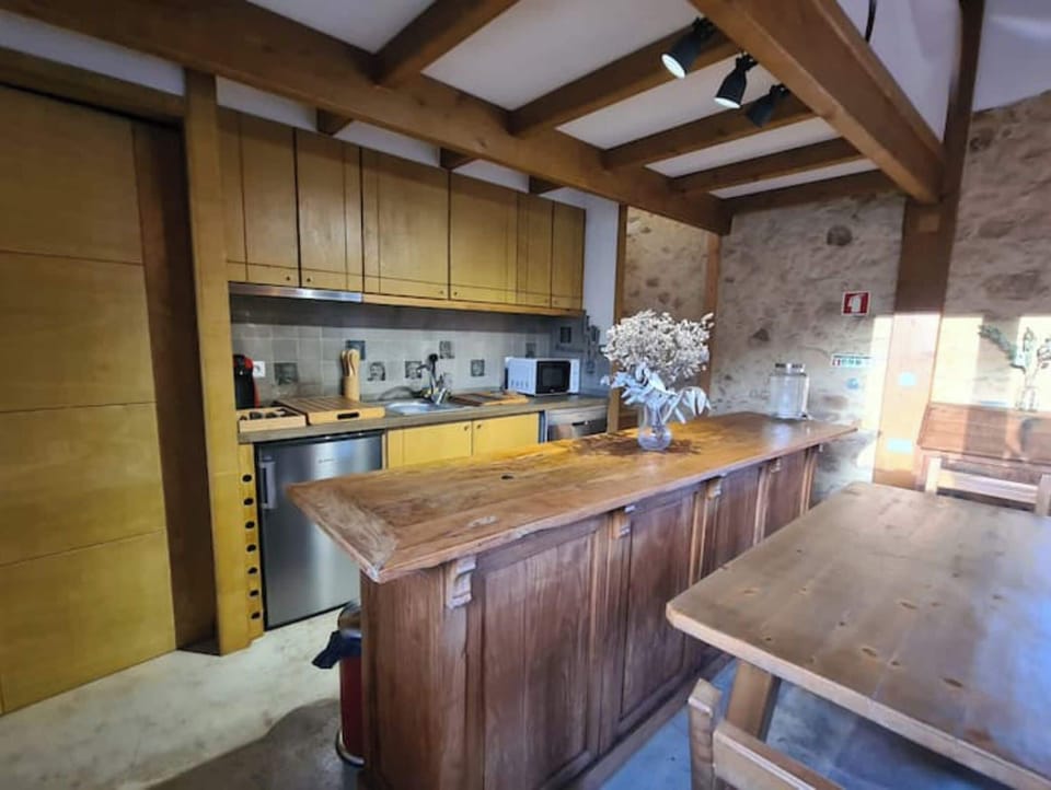 Kitchen with tiles of famous locals sporting popular moustaches of the era! 
