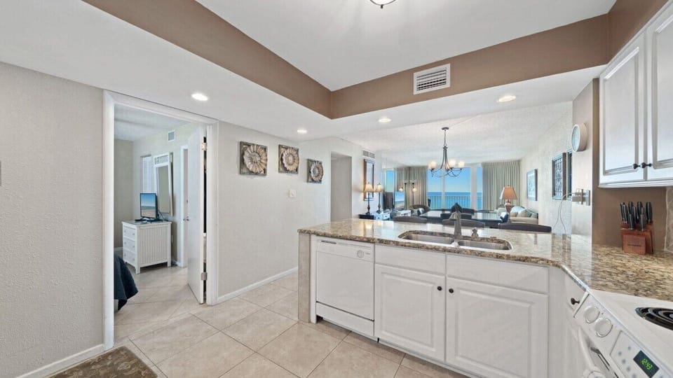 Spacious open layout with kitchen, dining, and living areas flowing together