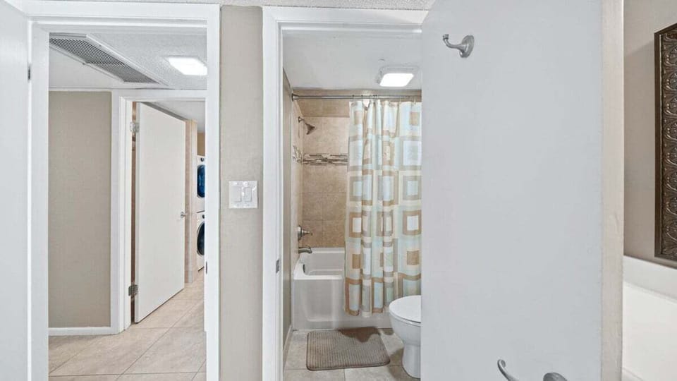 Master bathroom with full tub and seperate vanity area