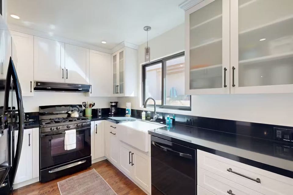 Fully equipped kitchen with cooking essentials and modern appliances for effortless meal prep.
