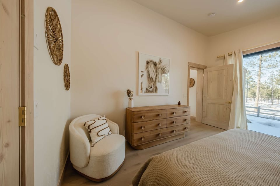 Bedroom 1 with king bed, with deck access and ensuite