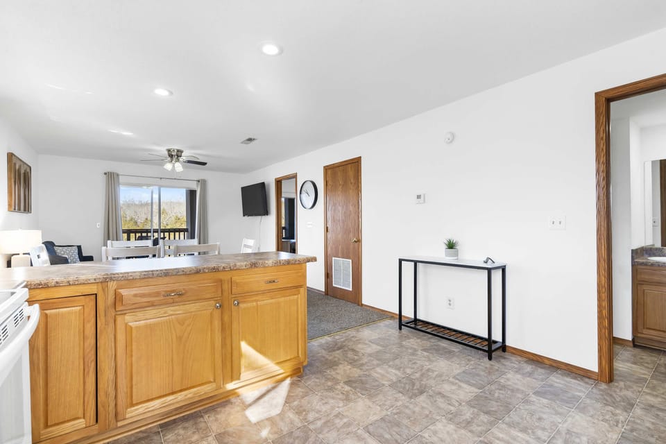 The open, airy kitchen offers ample space & every home comfort