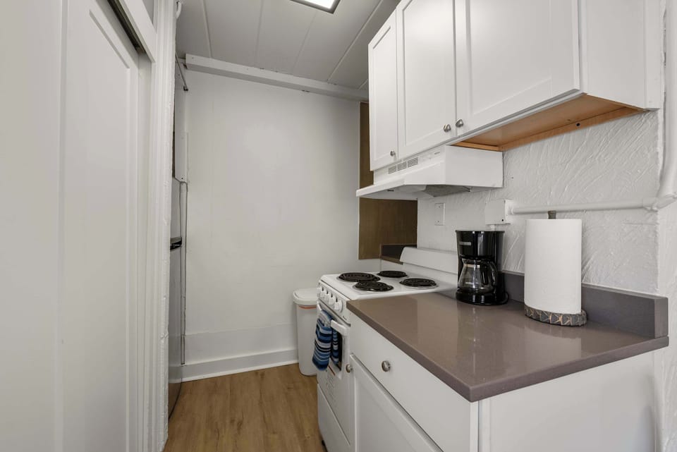 The cozy kitchen offers ample storage space & all the comforts of home​