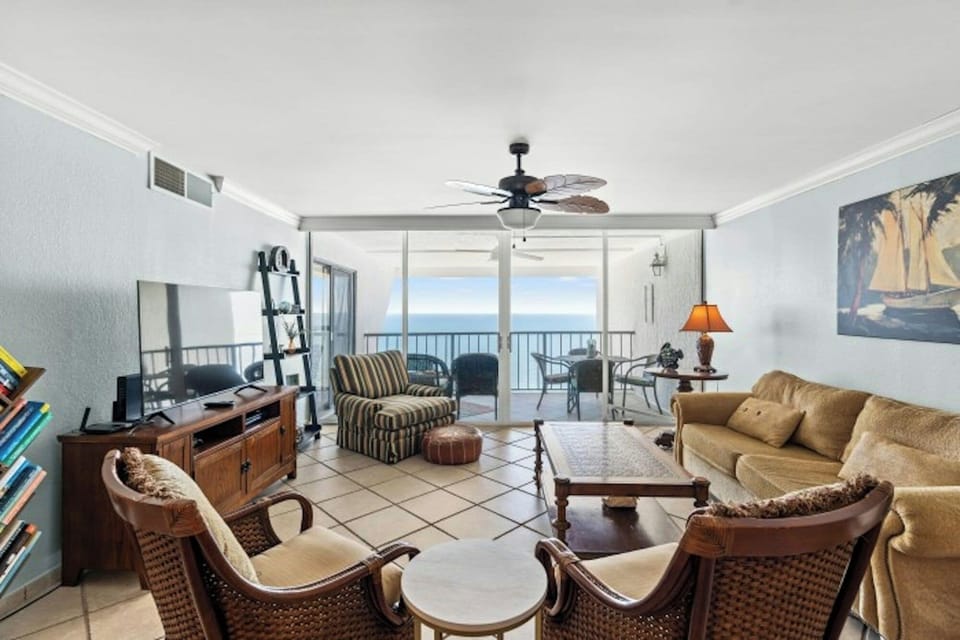 The ocean front living room is well-appointed with comfortable furnishings.