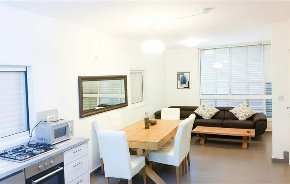 Open-plan layout delivers spacious feeling, comfortably hosting six people without compromising movement or relaxation space.