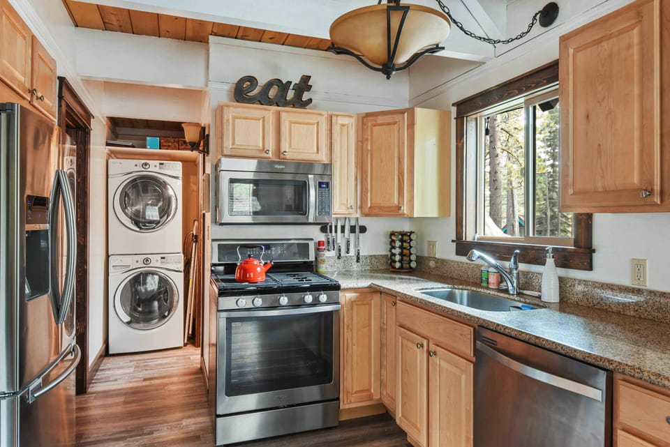 Full kitchen with drip coffee pot, slow cooker, blender, kettle, toaster and more
