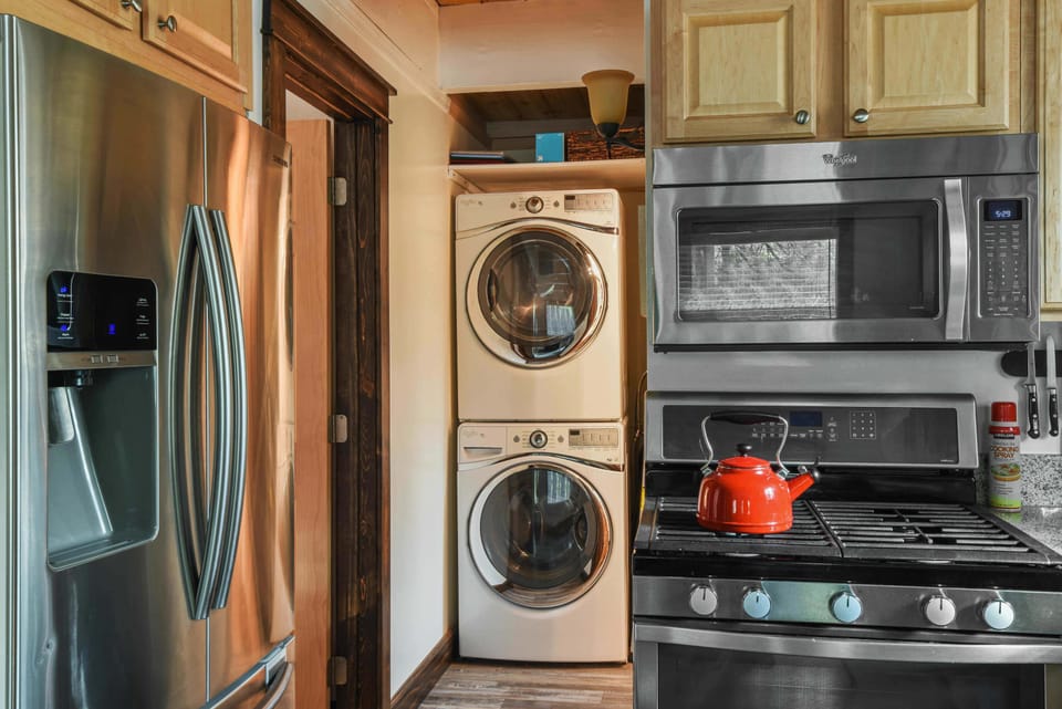 Full kitchen with drip coffee pot, slow cooker, blender, kettle, toaster and more (washer and dryer by kitchen)