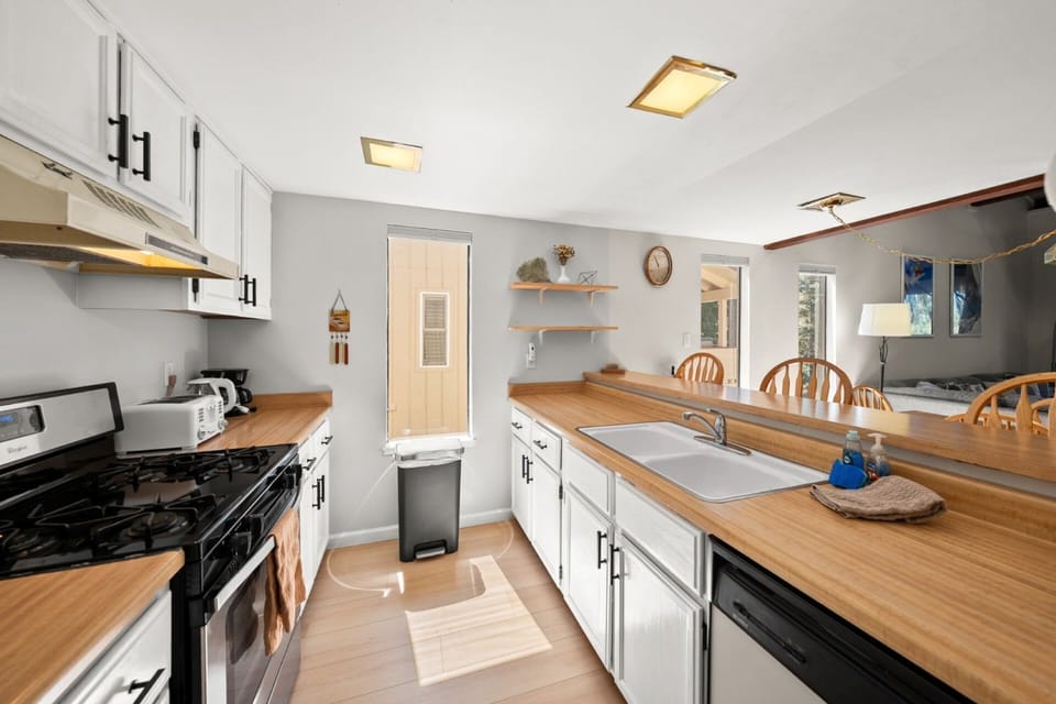 Full kitchen with open area face wall 