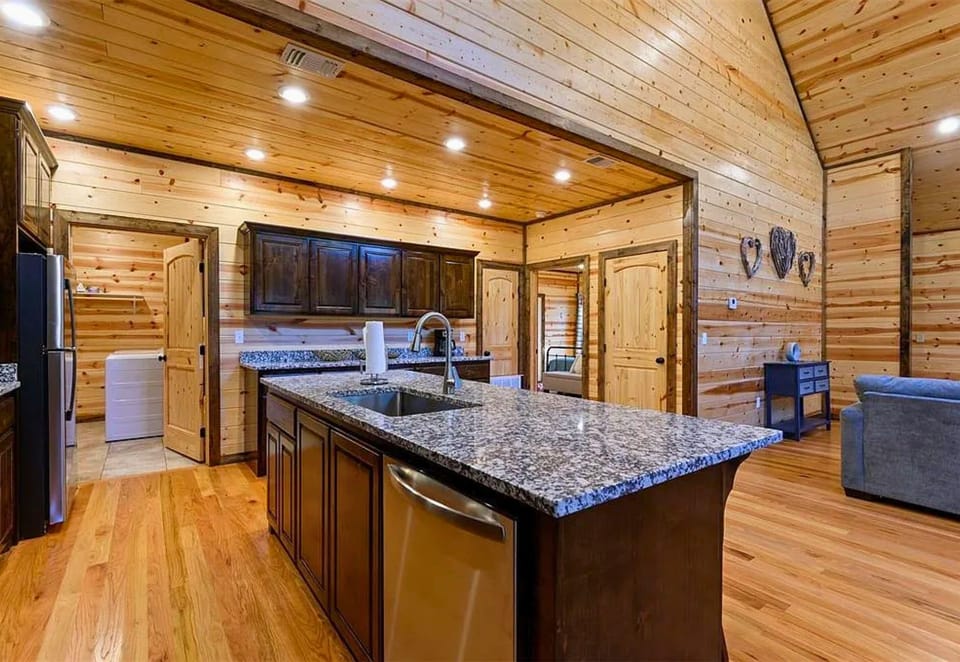 With its open-concept layout and large island, the kitchen makes meal prep a breeze while keeping everyone connected.