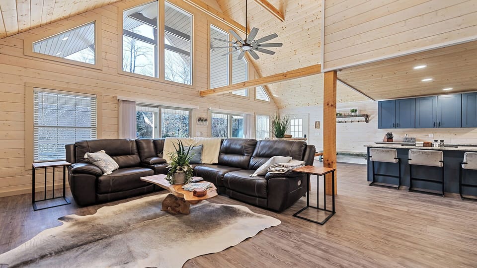 Bright, airy living space with vaulted ceilings and comfortable sectional views.