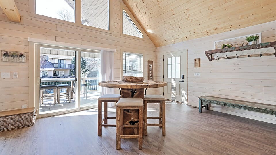 Cozy breakfast nook with large windows, perfect for enjoying your morning coffee