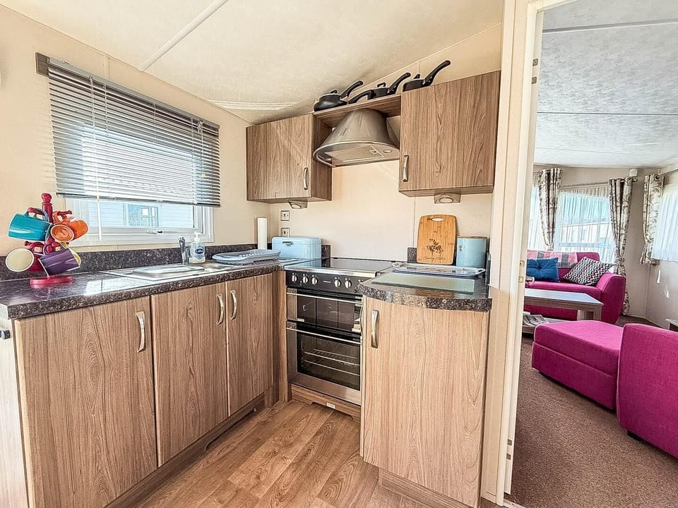 Prepare your favourite holiday meals while still being part of the conversation in this convenient open plan caravan kitchen.